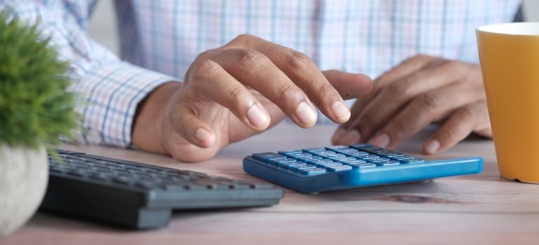 a man calculating the costs when preparing for a move from Florida