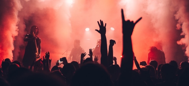 people at a concert with red lights