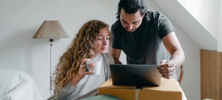 A couple searching the net for the reasons people leave Miami