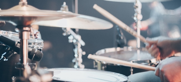 person playing the drums exploring the local music scene in Miami