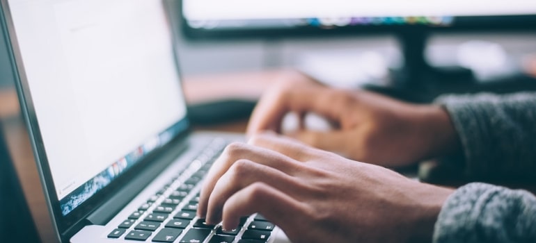 A person using a MacBook Pro