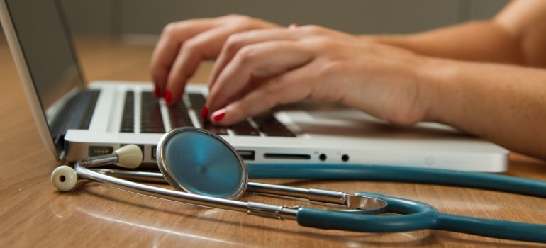 a person typing on the keyboard about senior’s Guide to Broward County