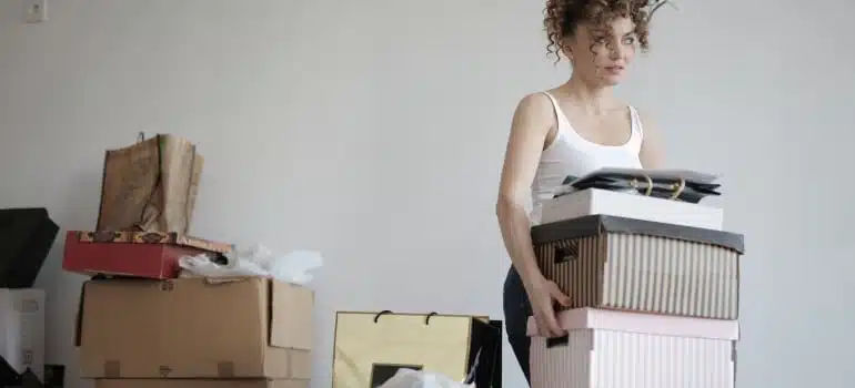 A woman carrying a box