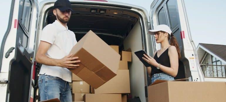 movers packing a truck