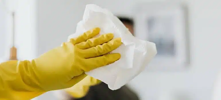Cleaning mirror in a modern bathroom.