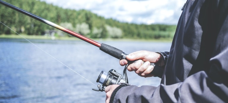 a person holding fishing pole 