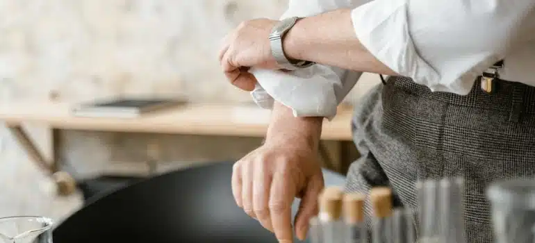 a man rolling up his sleeves and getting ready for emergency move to Hollywood