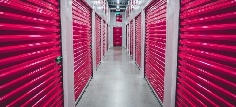 Purple shutter doors inside a storage facility 