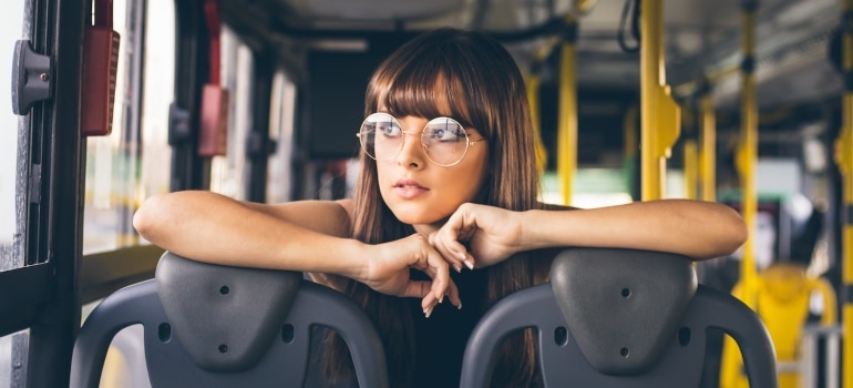 a girl in a bus thinking about discovering Surfside after moving