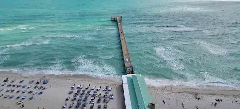 People on a beach near the Pier having fun after moving to Sunny Isles Beach