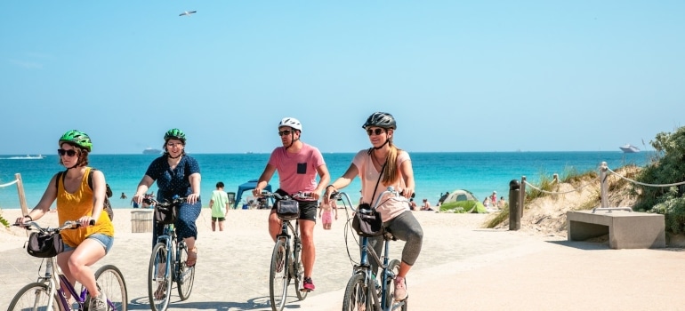 People cycling and exploring the best beaches in Miami