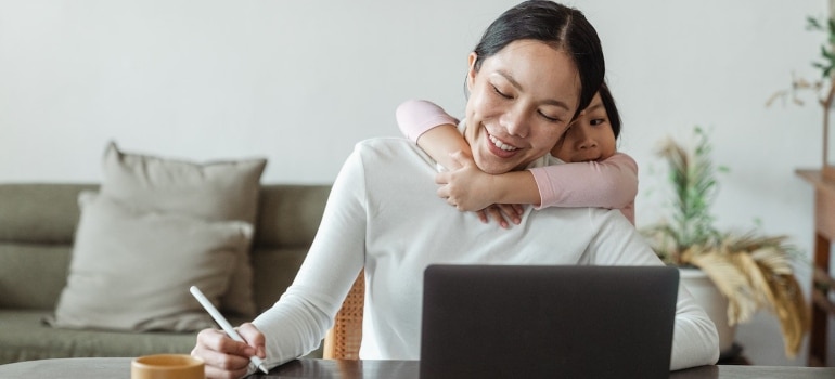 A child hugging her mother 