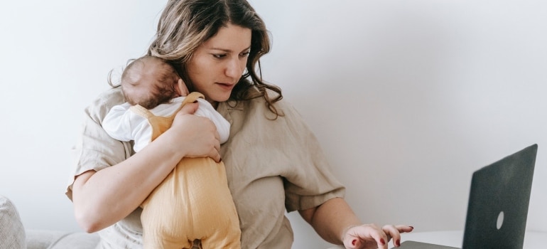 A woman searching the internet for home organizing tips for bisy parents