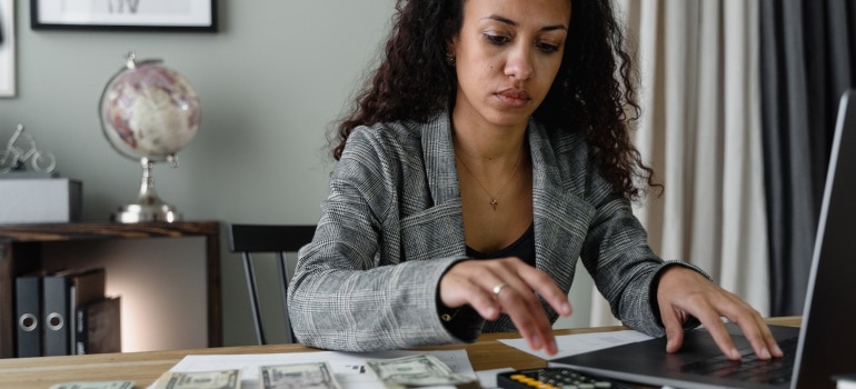 the woman works on the laptop