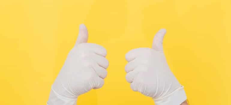 white gloves on a yellow background