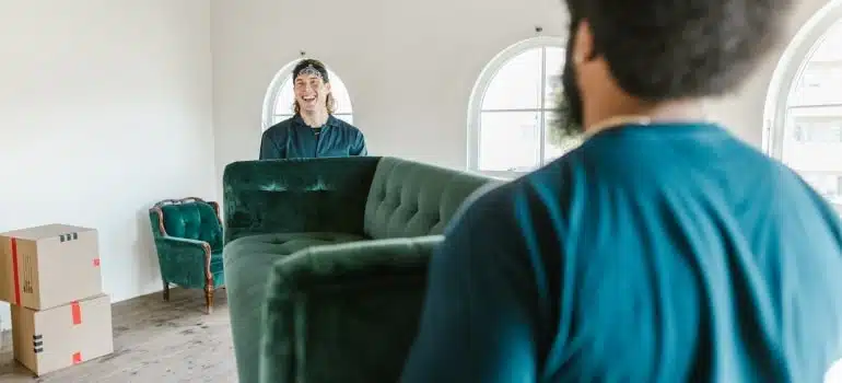 Movers carrying a sofa