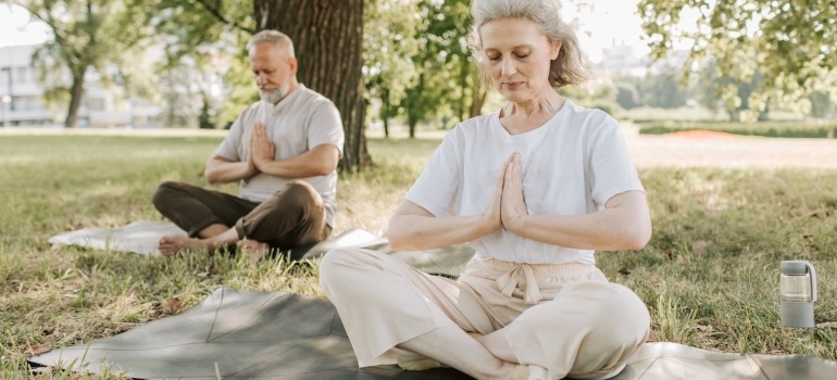 Seniors practicing yoga as one of the best senior-friendly activities