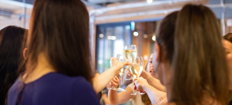 A group of people toasting at a going away party