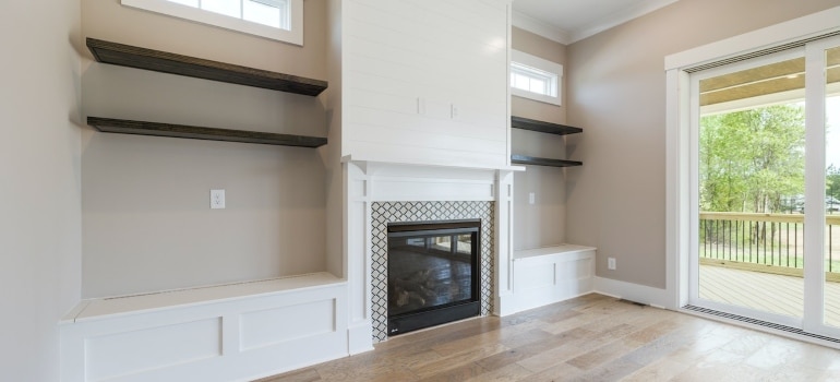 built-in shelves and a fireplace