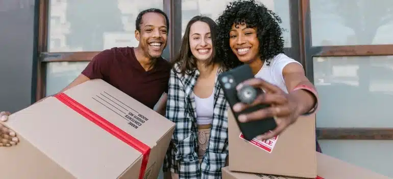 friends taking a photo before moving