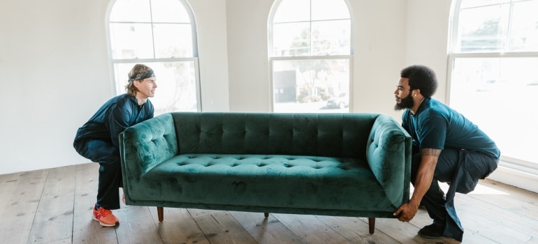 movers lifting a sofa