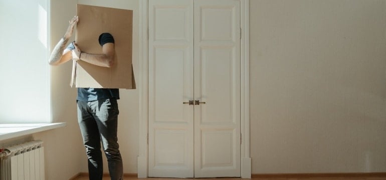a man having a cardboard box on his head