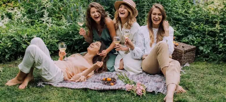 girls having a picnic in a park