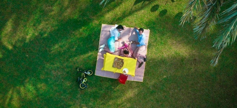 a family having a picnic talking about Moving to Doral with toddlers