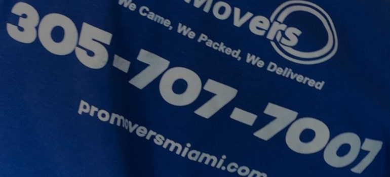 Pro Movers Miami contact on a mover's T-shirt.