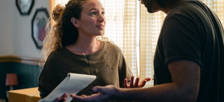 a couple discussing whether tohire movers even if you are moving locally in Hollywood