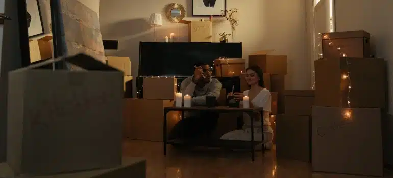a couple surrounded by boxes in a romantic atmosphere