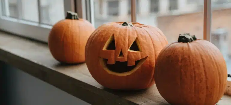Pumpkins on a window sill - one of the inevtable Halloween housewarming party ideas