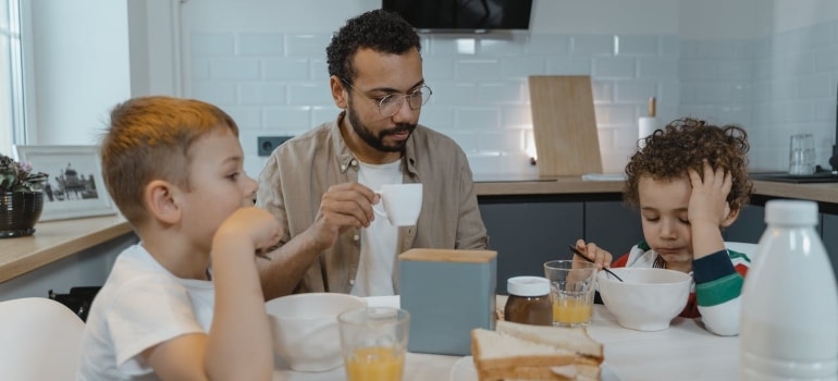 a dad having breakfast with children