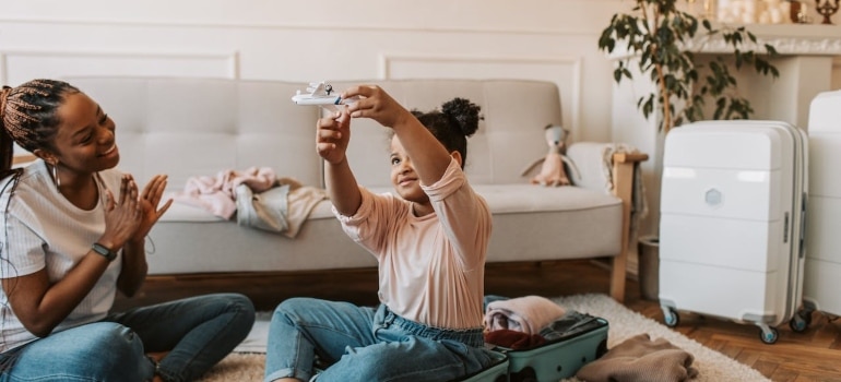 a mom packing with a daughter and having fun