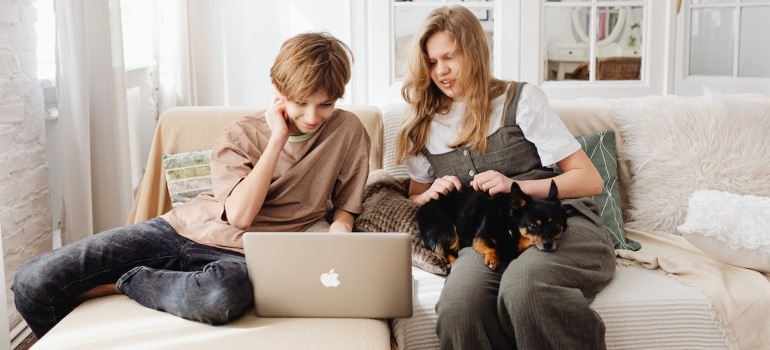 teenagers using a laptop