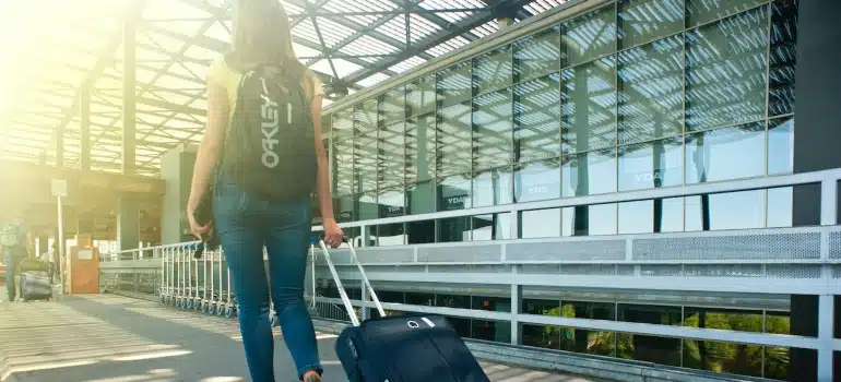 a teenager with a luggage