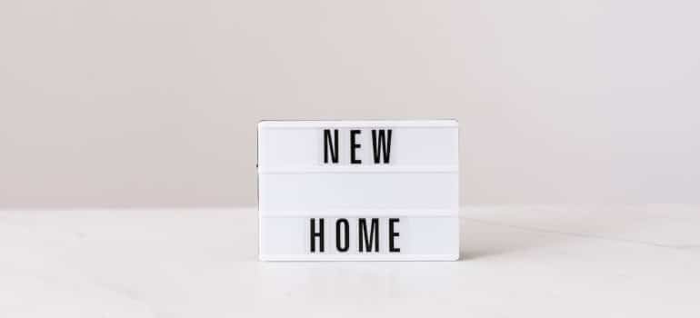 light box with 'new home' inscription