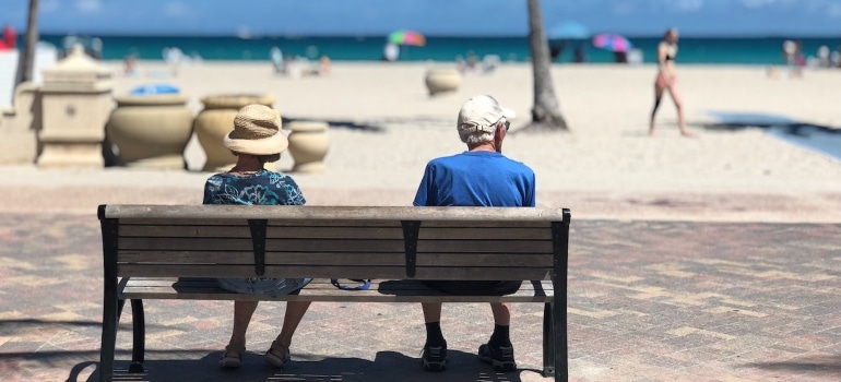 seniors sititing on a bench