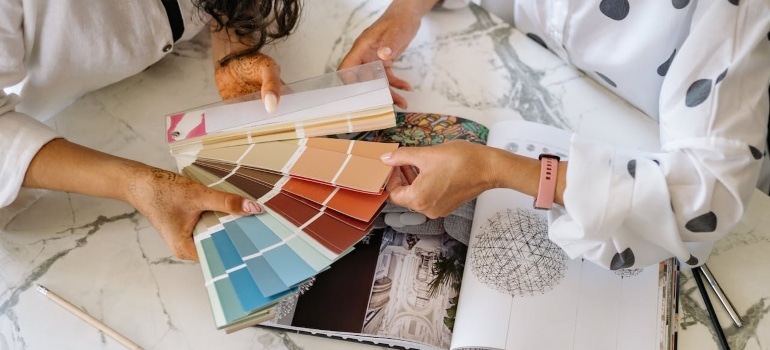 two women about to choose the color scheme for your Fort Lauderdale home interior