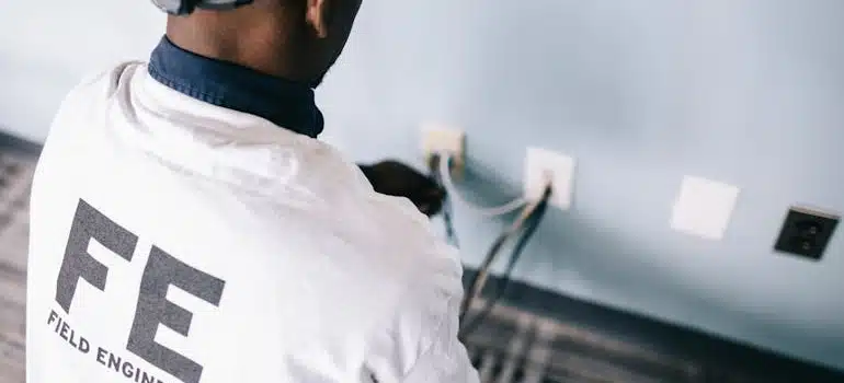 A field engineer is fixing an outlet