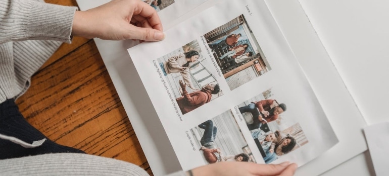 a woman holding photos