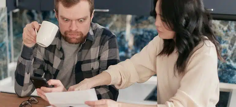 A couple revising high utility bills
