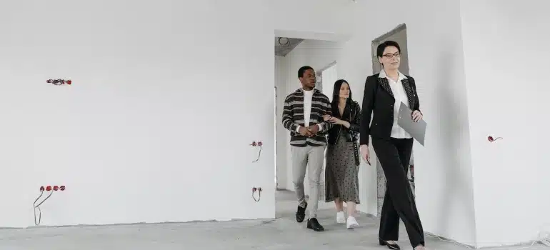 a real estate agent showing a house that is not finished yet 