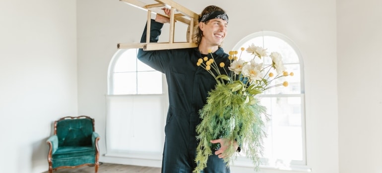 a mover holding a plant 