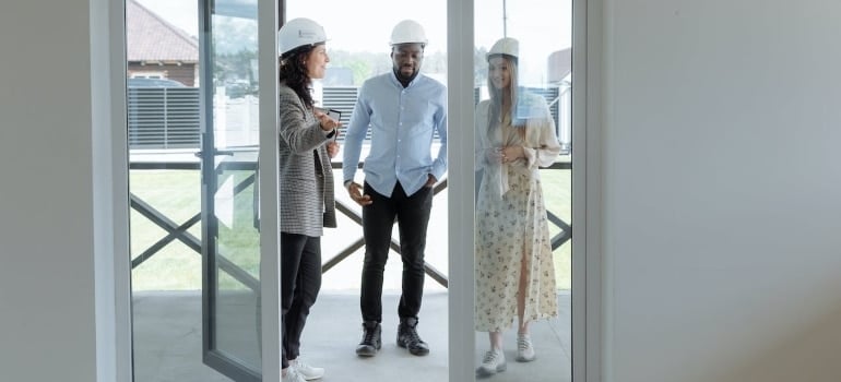 three people about to inspect homes for rent in Florida