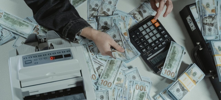 a person calculating before moving from Coconut grove to Fisher Island