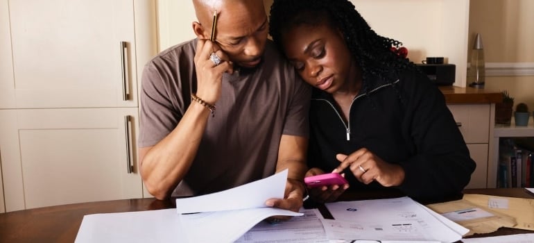 a couple weighing pros and cons of moving from Coconut Grove to Fisher Island