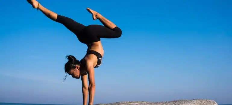 a woman doing yoga as one of the Fun things to do in Coral Gables after the move