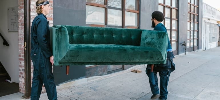 movers lifting a sofa