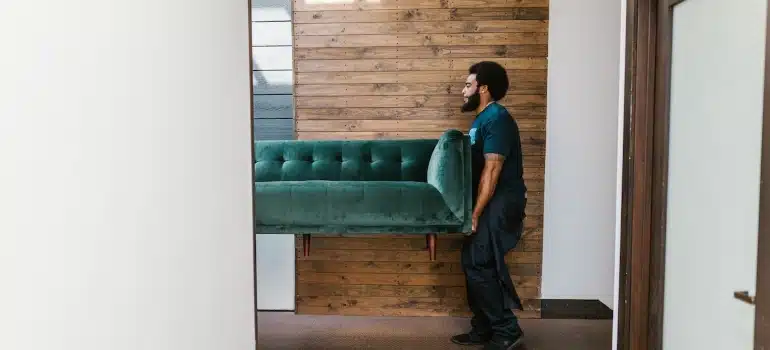 movers carrying a sofa